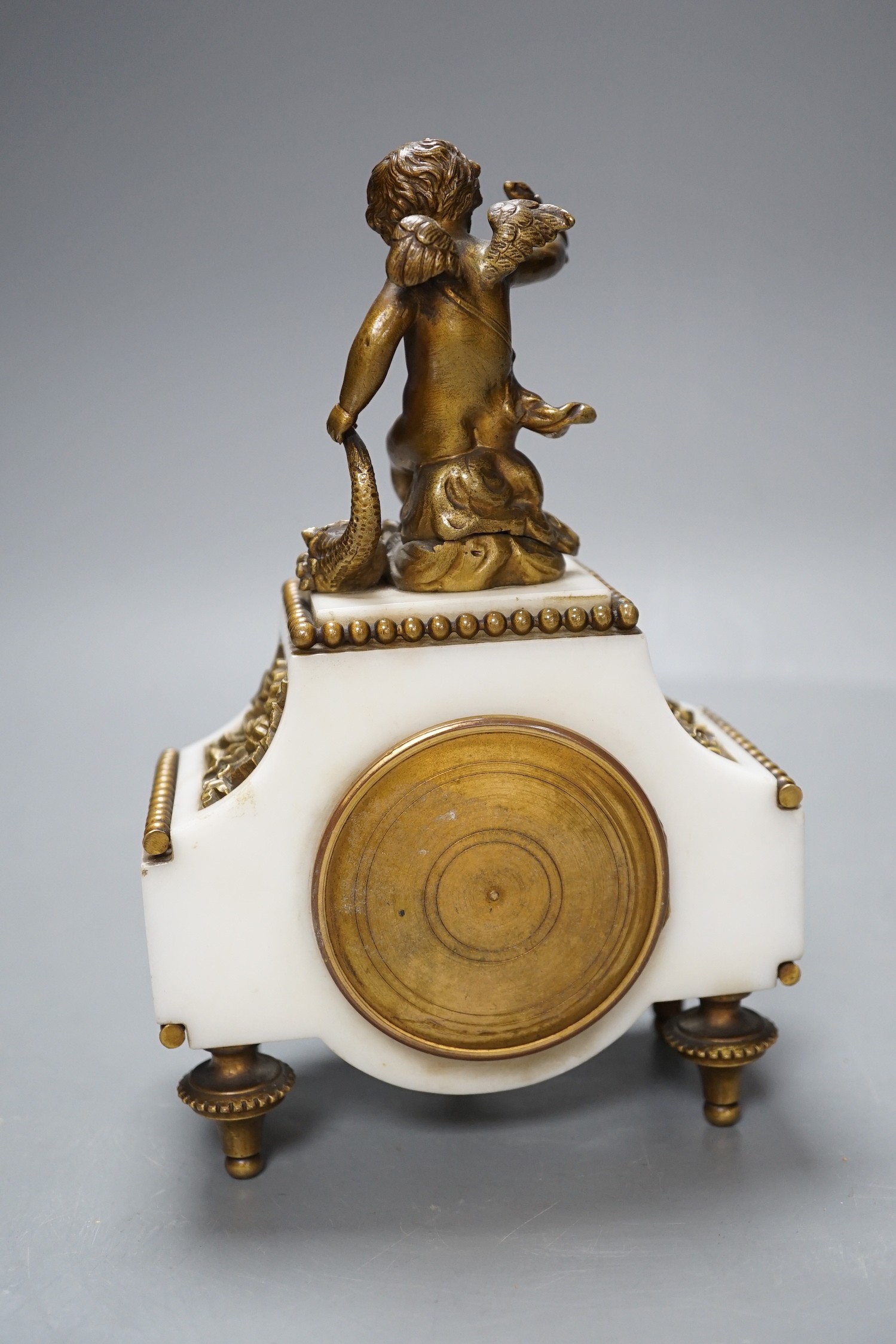 An early 20th century French marble and ormolu cherubic timepiece, height 19cm